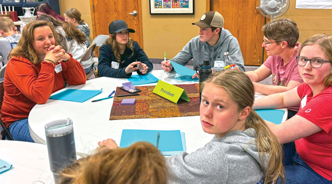 Benton County 4-H Club Officer Training was held last week. Pictured here are the 4-H Club Presidents learning how to lead a 4-H meeting. Pictures L-R around the table. JulieAnn Gerads. Mia Messerli, Roman Rudnitski, Adult Instructor Mandy Spiczka, Zoe Spiczka and Claudia Schlough. (Submitted Photo).