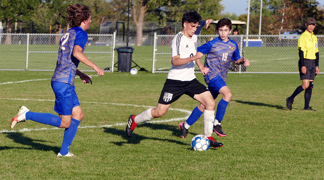 Junior Ander Alzaga provided an offensive spark for the Bulldog boys soccer team in the second half of the season.  Alzaga scored the lone goal of Becker’s playoff loss to Rockford.  He is pictured here in control of the ball in a game against Big Lake earlier this season (Submitted photo.)