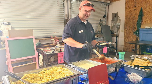 Dan Lunning of Cutting Edge Catering is pictured serving scrumptious pasta to attendees at the CVBC quarterly meeting.  (Photo by Mary Nehring)