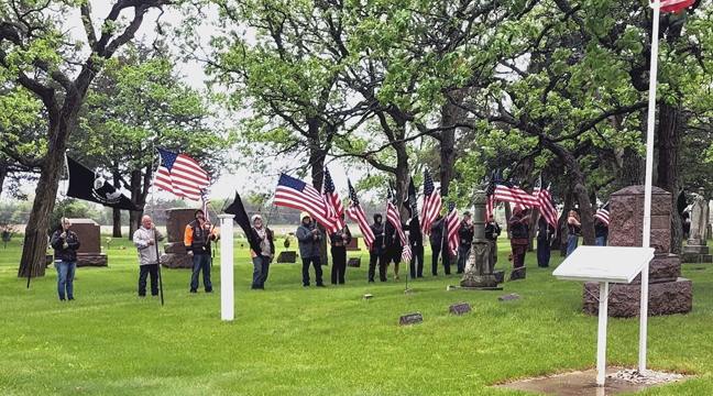 FLAGS DISPLAYED during the ceremony at Haven Cemetery. (Submitted photo.)