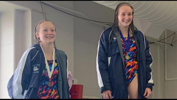 LAUREN WOELFEL (L) PLACED 3RD and Sarah Woelfel won the championship in diving at sections, securing themselves spots at the upcoming state tournament. (Submitted Photo)