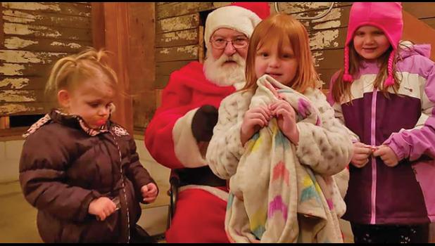FARM FRIENDS CHRISTMAS. Athena, Aurora and Arabella Winkelman shared their Christmas list with Santa at Farm Friends Barn 1st annual Christmas event over the weekend. (Submitted photo). 