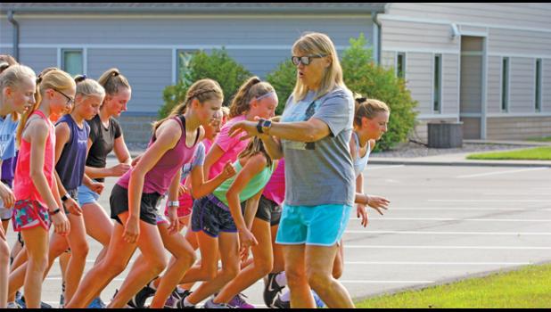 HEAD COACH TRISH REIMER-KEALY checked her watch as she gave the go-ahead to her girls cross country team to hit the course Thursday morning.