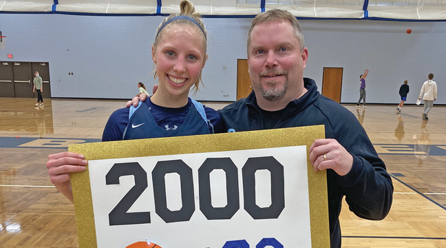Julia Bengtson and Coach Dan Baird took a moment after the game to celebrate her 2,000th career basketball points for the Becker Bulldogs (submitted photo). 