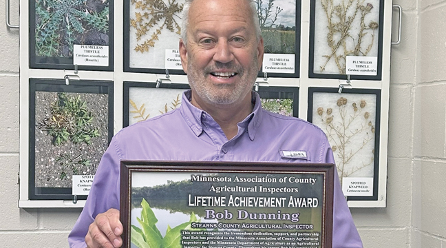 Stearns County Agricultural Inspector Bob Dunningwith his award. (Submitted Photo).