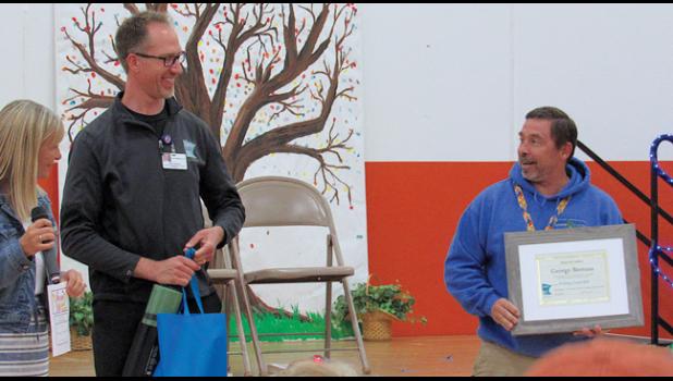 GEORGE BIENUSA receives a Health Hero award from CentraCare’s Feeling Good MN for initiating the Morning Mile at Clearview last fall. (Photo by Penny Leuthard)