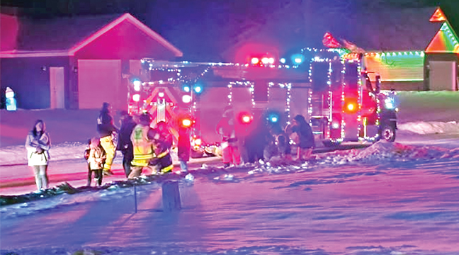 SANTA AND THE CLEARWATER FIRE DEPT. drove around Clearwater on a Sunday evening, spreading holiday cheer and collecting money and food for those in need this holiday season. (Submitted Photo)