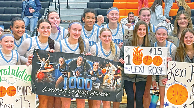 Lexi’s teammates  helped her celebrate her 1,000 point milestone. (Submitted Photo).