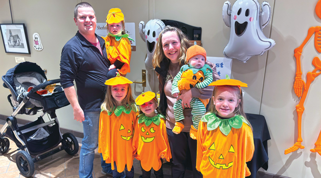 The Dessellier family dressed as pumpkins.  Collin, Luci, Erica, Gavin, Kenadee, Hazel, and Ava.  (Patriot Photo by Don Bellach)