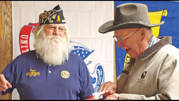 1ST VICE COMMANDER ROGER BIGALKE and a guest, Bob Dingmann, share a moment of levity at the Legion’s 100 year anniversary celebration. (Photo by Penny Leuthard)