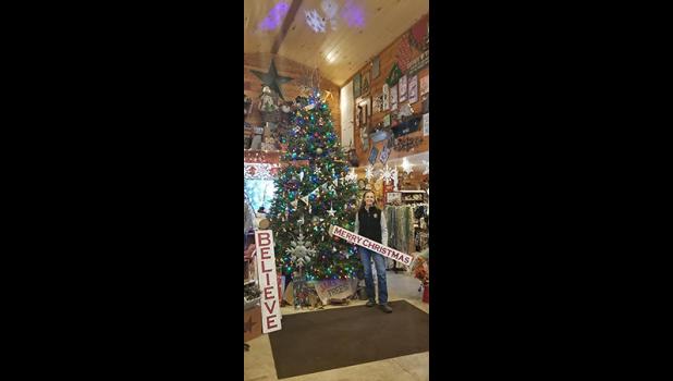 JAN DONELSON displays some of the thousands of items for purchase at Jan’s Christmas Trees and Gift Shop. (Submitted Photo)
