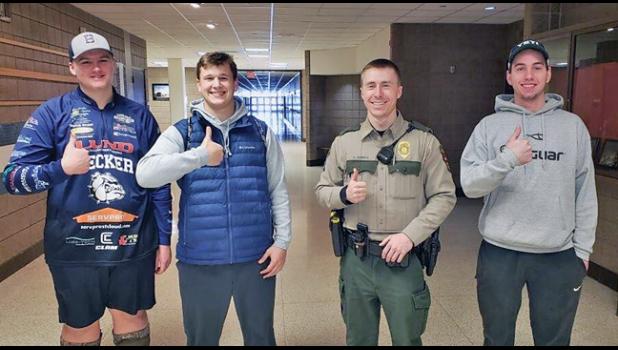 THUMBS UP. (L-R) Charlie Wright, Carter Hietala, DNR Trent Seamans and Jacob Novak.