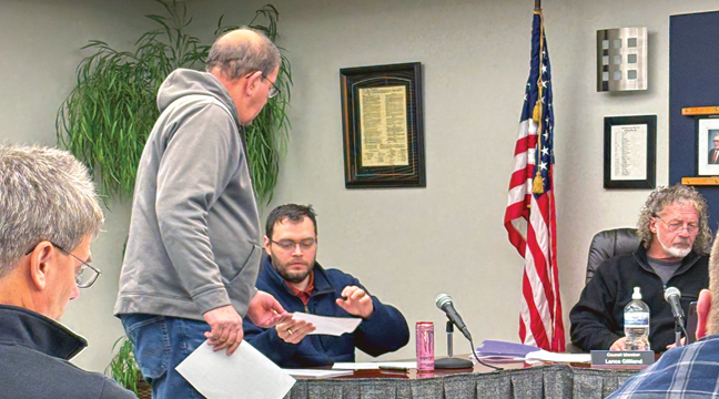 CLEAR LAKE Fire Chief Ron Koren submits his resignation to City Clerk Ryan McCann. (Patriot photos by Don Bellach)