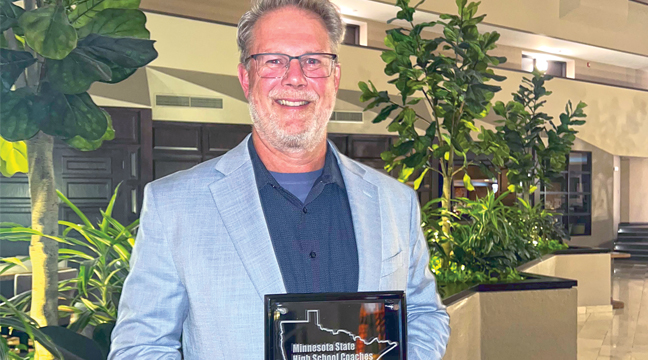 Becker Bulldog head boys track coach Paul Schmidt  was honored last weekend by the Minnesota State High School Coaches Association as the Championship Coach and Class AA Track and Field Coach of the Year for the 2024-2025 school year. Schmidt received his award at the annual coaches association banquet. Schmidt led his team to the state title last spring and his program has consistently produced individual state entrants over the past two decades. (Submitted Photo)