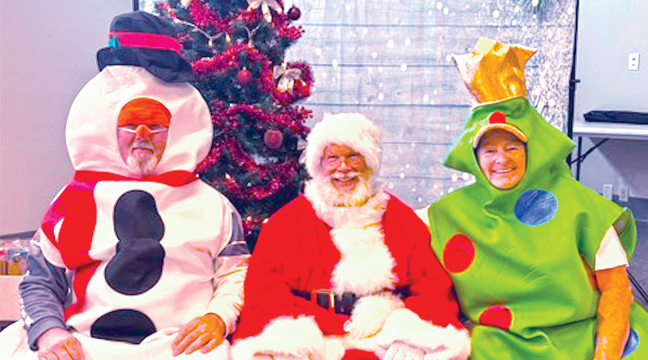 SANTA CLAUS brought along his friends Frosty and Christmas Tree to help him spread cheer at the Kid’s Christmas Party. (Submitted Photo)