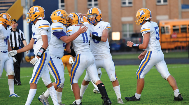 THE HORNET OFFENSE celebrates a big runagainst Columbia Heights last Friday. (Submitted Photo from Liz Bielejeski).