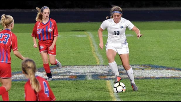 BULLDOG EMMA DOMKA takes control of the ball during the team’s match against Apollo Monday night. (Submitted Photo)