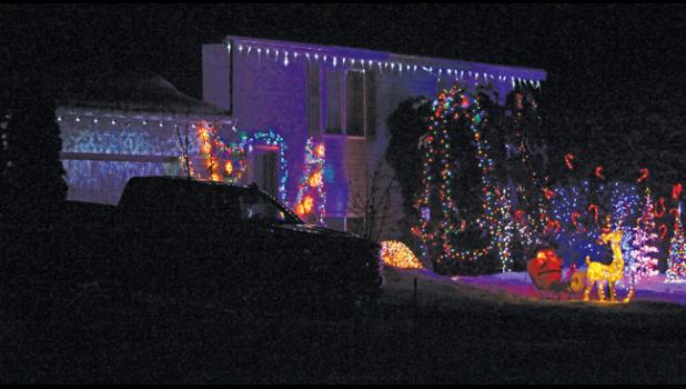 THIS HOME ALONG ROLLING RIDGE RD. was not on the official ballot but it could have been with its beautiful display of house lights and yard art. 