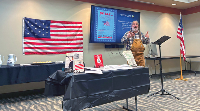 Dan Gruhlke helped the Sherburne History Center celebrate Veterans Day with his lively historical presentation into the giant flag that served as the inspiration for the Star Spangled Banner (Patriot Photo by Mark Kolbinger). 