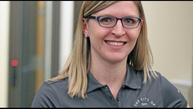 MARIE PFLIPSEN (L) modeled the new polo shirts that feature the new City of Becker logo. (Photo by Bill Morgan).