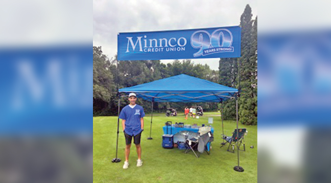 NUMEROUS SPONSORS had tents along the course where they featured games, snacks and prizes. Above, was a booth manned by a volunteer from Minnco of Big Lake. (Submitted Photo).