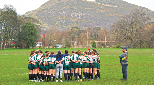 THE MINNESOTA TEAM consisting of players from four Minnesota schools, huddled before a match in Scotland recently. (Submitted Photo).