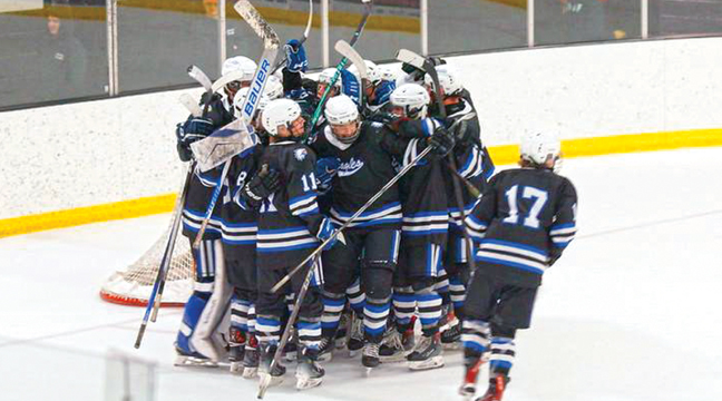 The Becker/Big Lake Eagles hockey team celebrates after beating the Princeton Tigers 4-0 for the first time in Eagles history. (Submitted Photo).
