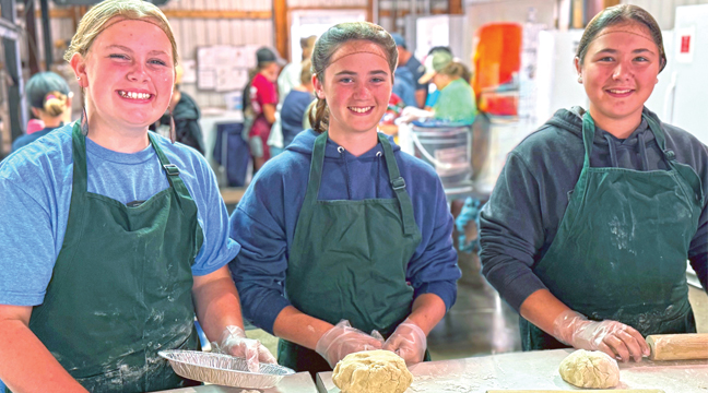 These three ladies had their first experience with the Benton County 4-H pie making day. New members of Benton County and part of the Duelm 4-H Club, these 4-H’ers were hard at work rolling out pie crusts. (L-R) Kaylin Maloney from Elk River, Jubilee LaDoux and Lola LaDoux from Dayton. (Submitted Photo).