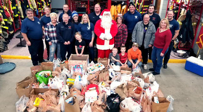 1,001 POUNDS OF FOOD was collected by Santa and the Clearwater Fire Dept. that will be donated to the Clearwater/Clear Lake Area Food Shelf. (Submitted photo.)