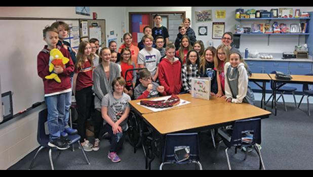 ANDREW SCHMIDT’S CLASSMATES in middle school helped Andrew celebrate PKS Day with pizza, lunch, cupcakes and friendship. (Submitted Photo).