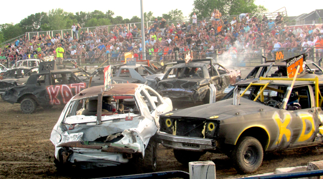 THE ARENA WAS PACKED with lots of contestants during the beginning of the featured demo derby. (Photo by Penny Leuthard.)