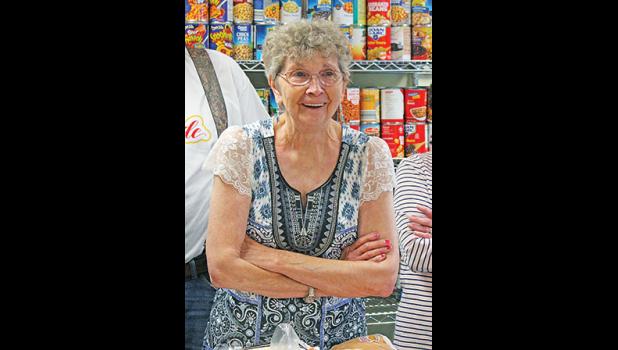 JANET Boettcher was all smiles as she learned LDI/LPI was donating $10,000 to the Becker Food Shelf as well as an industrial refrigerator to keep milk, eggs and other perishables cold. (Photos by Bill Morgan).