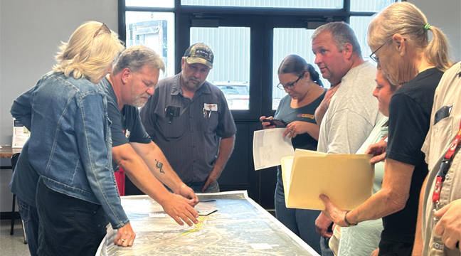 CLEARWATER AREA RESIDENTS AND BUSINESS OWNERS stop by MnDOT’s public meeting Monday to see the final plans for the Hwy. 24 corridor project. (Photo by Penny Leuthard)