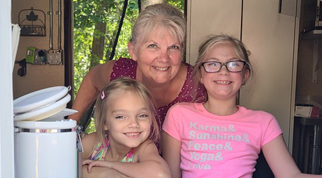 A sale north of Becker offered a food truck to shoppers. The food truck also served up homemade ice cream. Evelyn and Ryiah of Becker served up ice cream with their grandmother (Kayla) of Little Falls. (Patriot Photo by Mary Nehring). 