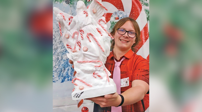 Sweet success! Benton County 4-H Ambassador Eli Rademacher proudly shows off his trophy after being crowned the 2025 Ambie Cane Challenge Champion at Ambassador Candy Cane Night in Foley.. (Submitted Photo).