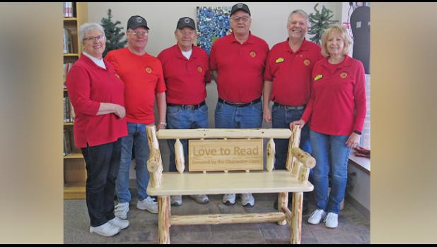 CLEARWATER LIONS Jane Gohman, Pete Kroeplin, Doc Gohman, Jack Kuechle, President Ken Abraham and Mary Abraham with the bench their organization donated to the Clearwater Library in March. (Photo by Penny Leuthard)
