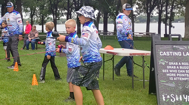 BIG LAKE BASS TEAM MEMBERS played a game to practice casting. (Photo by Katherine Cantin.)