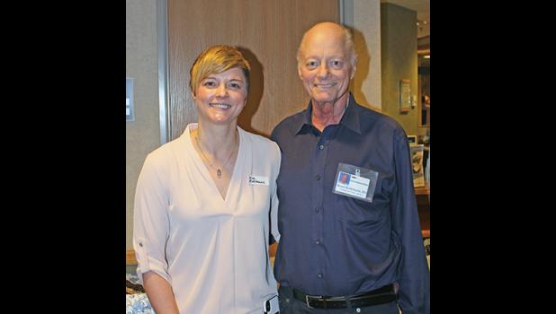 DR. BRUCE KUHLMANN (R) is very proud of his daughter, Erica (L), who is also a DO practicing medicine in the Twin Cities. (Photo by Bill Morgan).