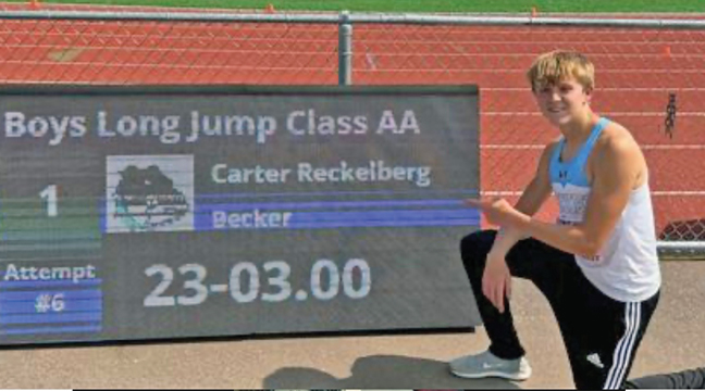 Carter Reckelberg won the blue-ribboned medal and set a new Class AA state record for the Long Jump by leaping 23 feet, 3 inches.