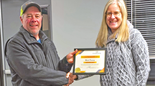 CLEARWATER MAYOR ANDREA LAWRENCE presents Mark Doering with a public service award. (Submitted Photo)