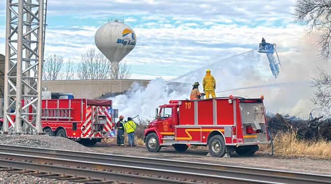 CREWS battled for days to temper the embers and keep the fire from spreading. (Patriot Photo by Don Bellach).