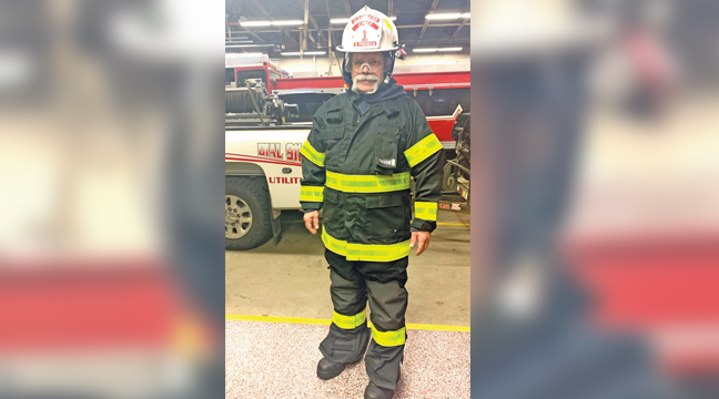 FIRE CHIEF RYAN PRIDGEON dons one of the new turnout gear sets purchased by the Clearwater Fire Dept. with CARES Act funds. (Photo by Penny Leuthard)
