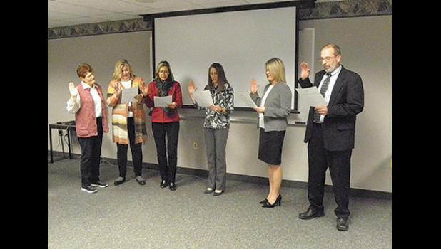 Members of the Monticello-Big Lake Hospital Board were sworn in during Thursday’s annual meeting. (From left) Nancy Friesesn, Linda Kappel (presiding), Linda Mielke, Bronwyn Ewert, Leah Hirsch and Jim Dickinson. (Photo by Ken Francis.)