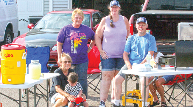 THE BOUCHER FAMILY AND FRIENDS hosted a block party in Becker Tuesday as part of the Night to Unite festivities. Front, is Carolmartine Mason and two-year-old Emerson. Back, left to right, Joanne David, Sarah Boucher and Tim Boucher. (Patriot Photo by Bill Morgan)