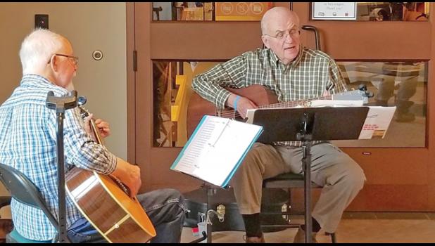 GUITARISTS CLIFF CROCKFORD and John Seppanen provided background ambiance during Monday’s reception. (Submitted Photo)