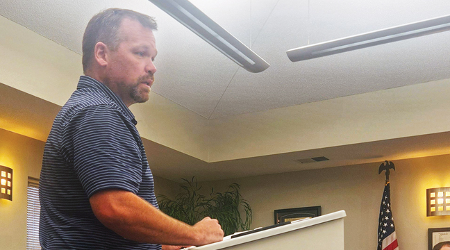 MIKE GOLOMBIECKI of the Clear Lake Baseball Team approached the council to discuss recent improvements to the ball field. (Photo by Katherine Cantin.)