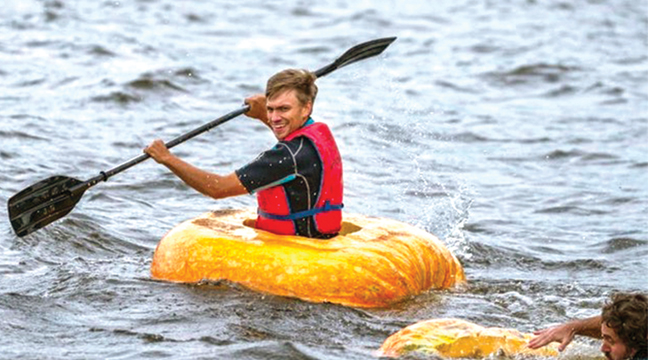 Noah Friedman paddling in his giant pumpkin. (Submitted Photo).