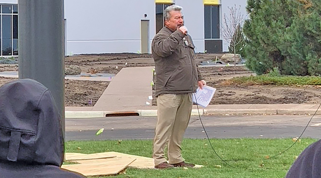 UMC CEO Don Tomann addressed the crowd that gathered around the flag pole Thursday afternoon. He gave a stirring speech, thanked the veterans and his employees and had the veterans attach and release the gigantic flag to the winds. (Patriot Photo by Bill Morgan).