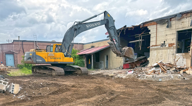 DEMOLITION OF THE buildings behind the post office and Bill’s Superette in Becker was occuring this week in preparations for future construction of a new Bill’s Superette store. (Patriot Photo by Bill Morgan).