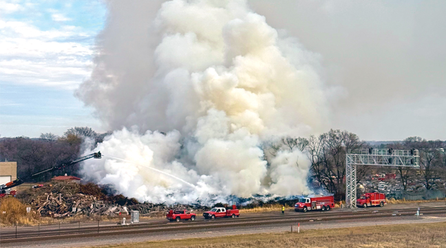 A LARGE DEBRIS FIRE broke out Saturday morning at the Big Lake Public Works compost site. Dozens of firefighters from all over the region descended upon the location to ensure it didn’t spread to neighboring properties. (Patriot Photo by Bill Morgan).